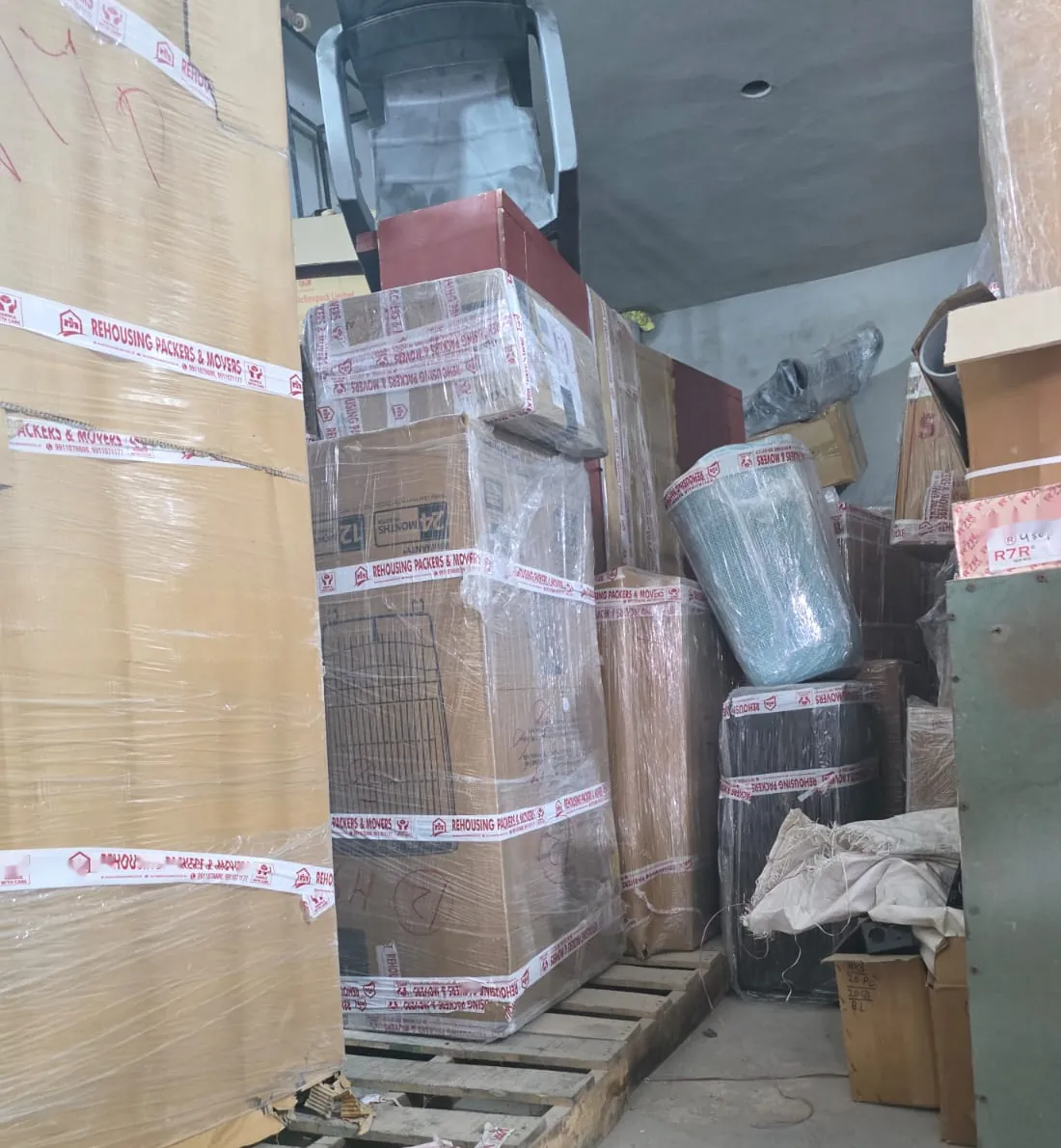 Packed cartons stacked on pallets at the Sector 102 warehouse